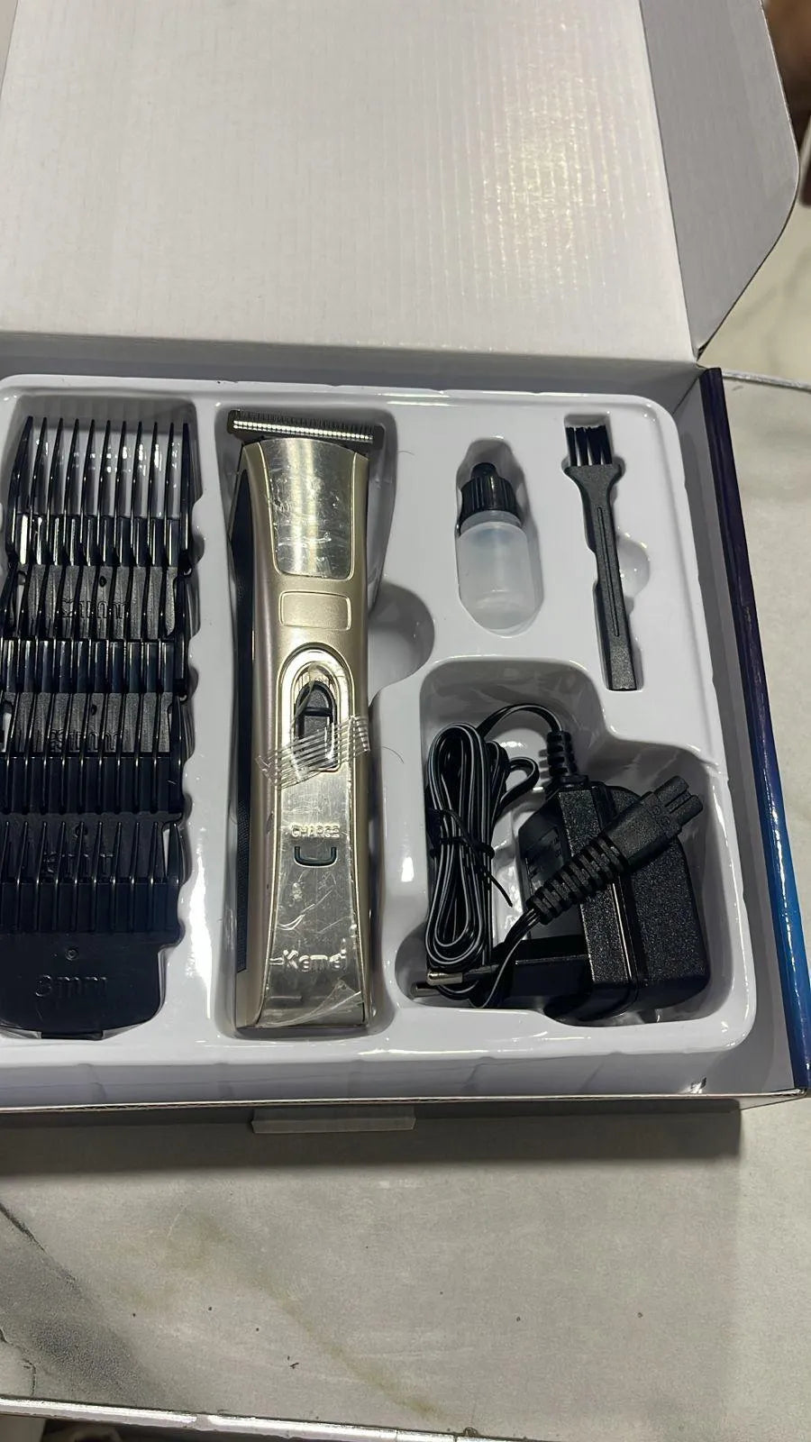 Kemei Men's Rechargeable Hair Trimmer with Easy-Clean Design